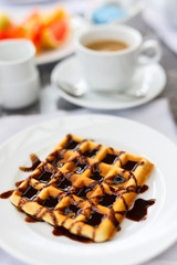 Delicious waffles with coffee