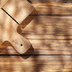 Empty board with fork and knife on wooden table