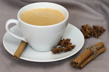 A Cup of coffee with star anise and cinnamon