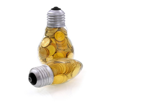 Traditional  lightbulb with  golden coins
