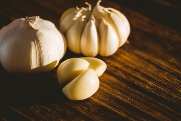 Garlic cloves and bulb on chopping board