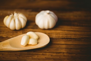 Garlic cloves and bulb on chopping board