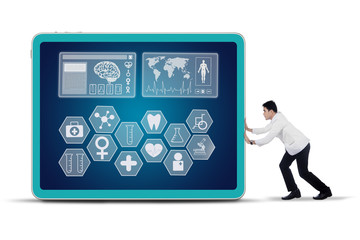 Doctor pushing medical symbol