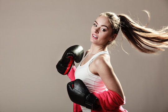 Feminist woman training, boxing.