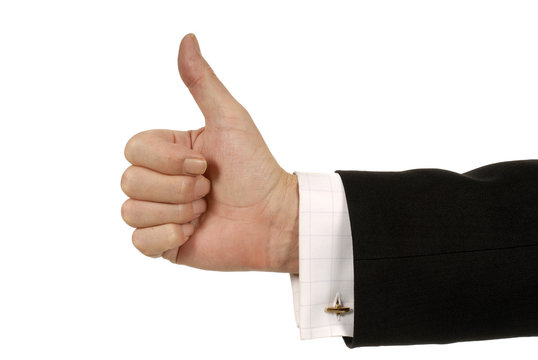 Businessman with thumb up isolated on white background photo