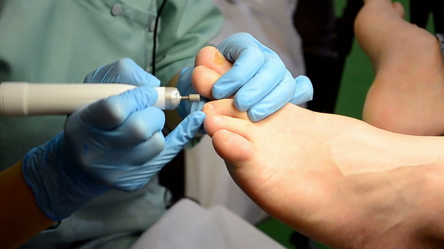 pedicure (nails polishing) in beauty salon