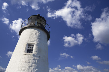 lighthouse in the cloudy sky