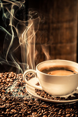 Taste cup of coffee with roasted seeds - obrazy, fototapety, plakaty