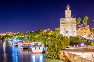 Seville, Spain at the Torre de Oro on the Guadalquivir River.