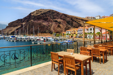 Reataurant tables in beutiful port, Madeira island, Portugal