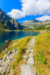 Fototapeta na wymiar Hiking trail along Czarny Staw lake in summer, Tatra Mountains