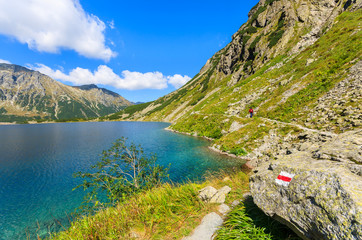Hiking trail along Czarny Staw lake in summer, Tatra Mountains