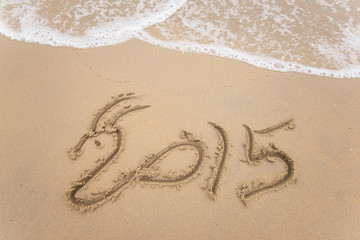 new year 2015 written in sand