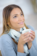 Woman having a coffee at home
