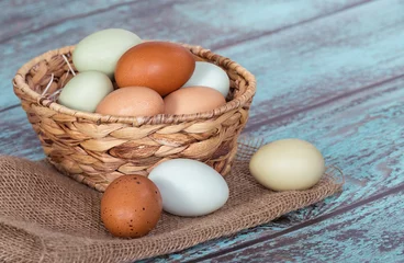  Fresh chicken eggs in a basket © leekris
