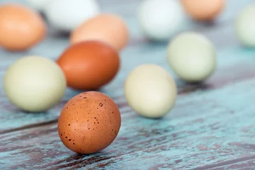 Gordijnen Assortment of different color fresh chicken eggs © leekris