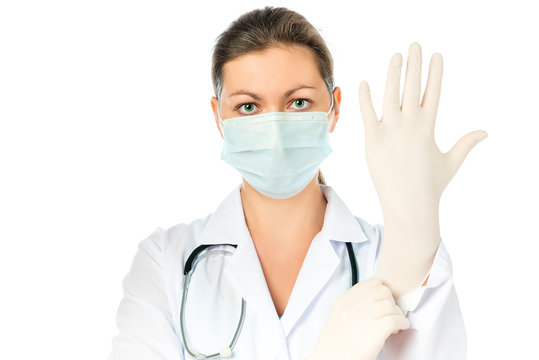 woman surgeon preparing for surgery put on gloves