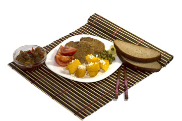 vegetarian food with sauce and with bread, on a white plate