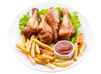 plate of grilled chicken leg with french fries