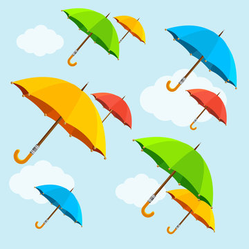 Vector colorful umbrellas fly with clouds. Flat Design