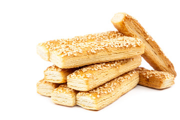 Puff biscuits with sesame seeds isolated on white background.