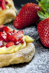 Zeppole with strawberry- tipical italian pastry