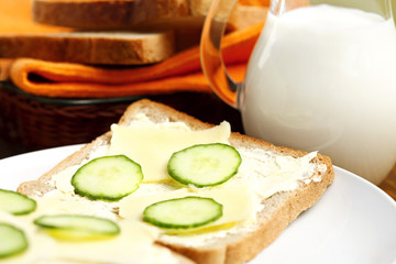 tasty sandwich with cheese and cucumber