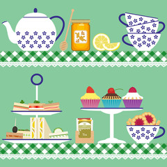 Tea set with sandwiches,  cupcakes and honey jar