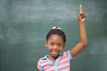 Pupils raising hand in classroom