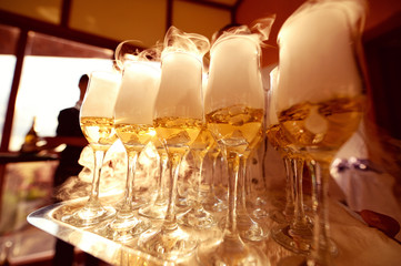 glasses with champagne on a try