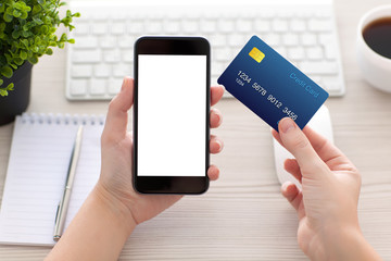 female hands holding phone with isolated screen and credit card