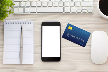 phone with isolated screen and credit card on the table