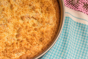 Freshly baked apple crumble pie in a springform
