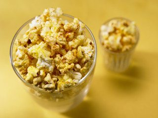 two difference size of popcorn side by side