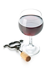 glass of red wine and corkscrew