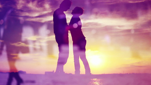Silhouettes of Romantic Love Couple Meeting in Sunset Kissing