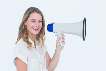 Fototapeta premium Woman speaking through a loudspeaker