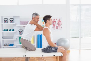 Doctor examining his patient back