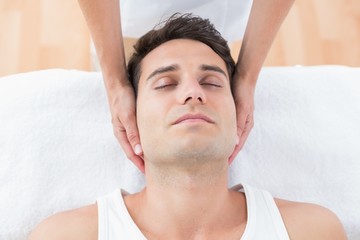 Fototapeta na wymiar Man receiving neck massage