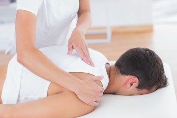 Fototapeta na wymiar Physiotherapist doing back massage