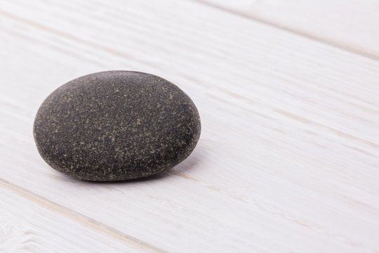 Pebble on a wooden table