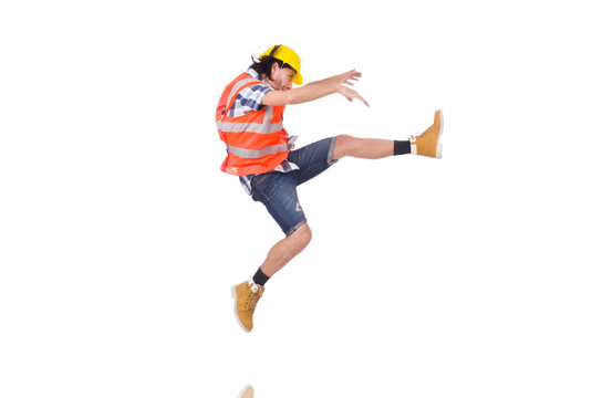 Falling young construction worker isolated on white