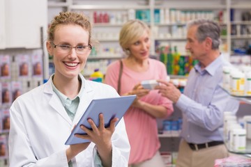 Fototapeta premium Pharmacist using tablet pc