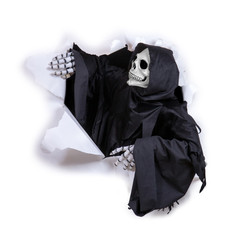 Grim reaper looking through hole torn in white paper