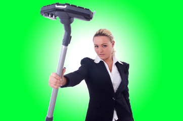 Businesswoman with vacuum cleaner on white