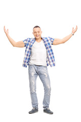 Casual young man, smiling and gesturing with his hands