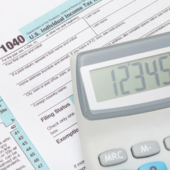 Calculator over US 1040 Tax Form