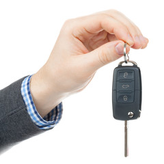 Male hand giving car keys - studio shot isolated on white backgr