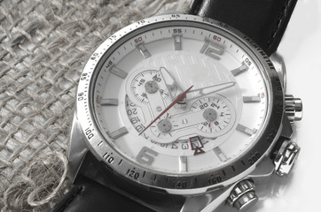 Silver watch on canvas