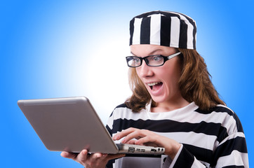 Criminal hacker with laptop on white